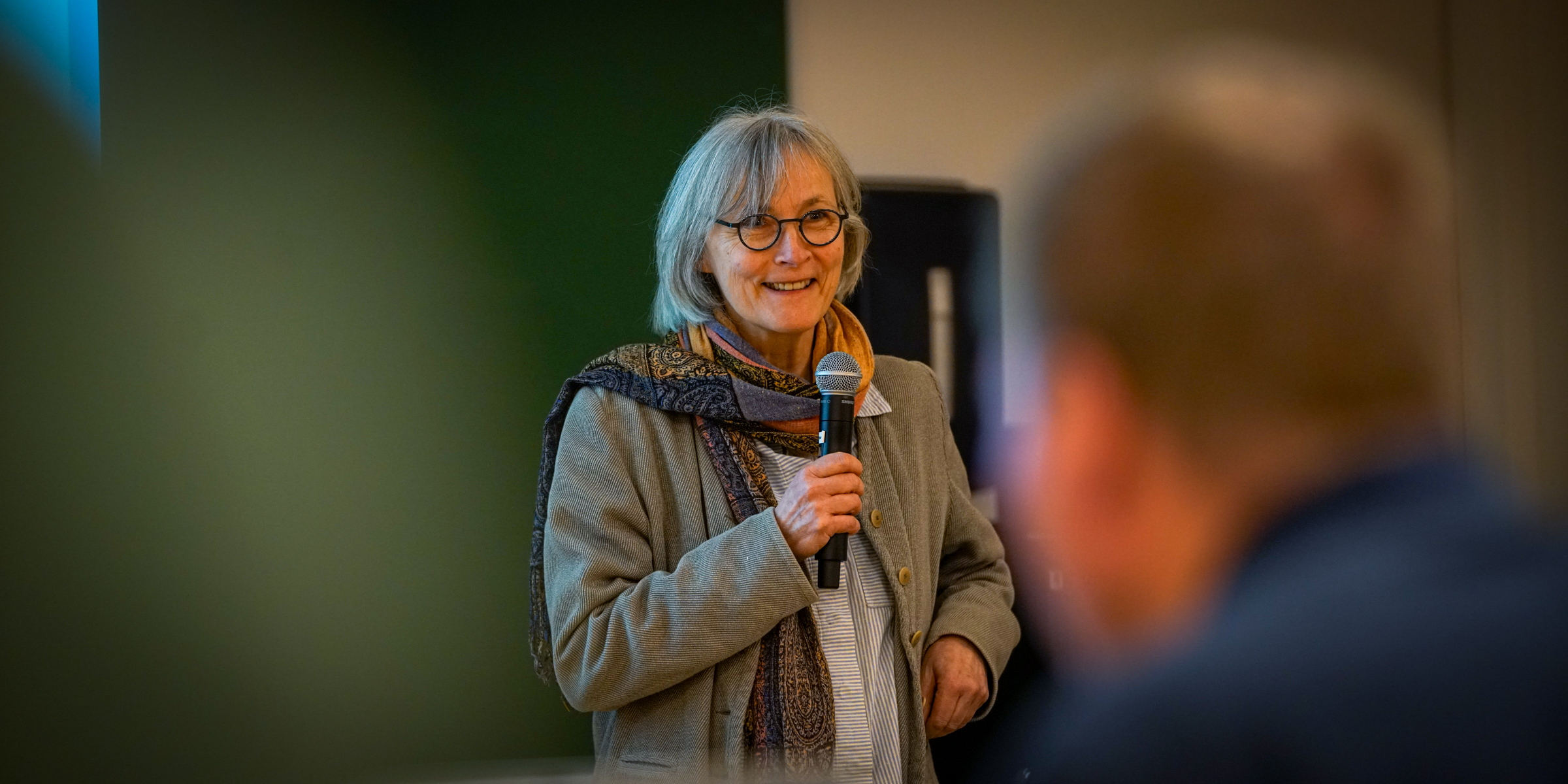 Virginie Amilien speak with a microphone.