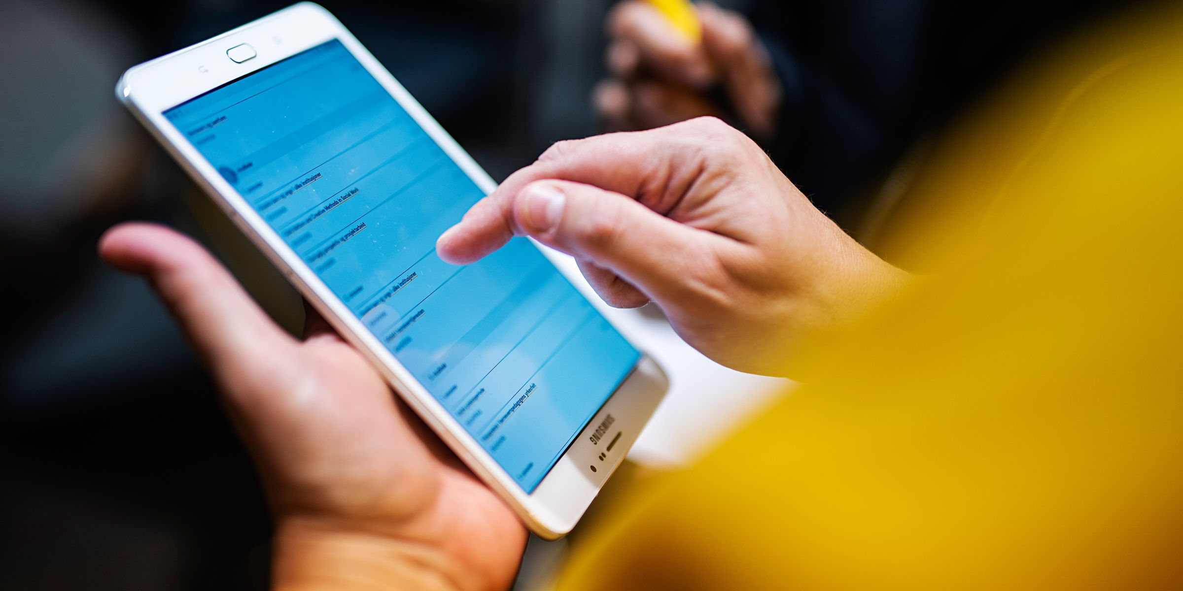 Close-up of hand holding a phone.